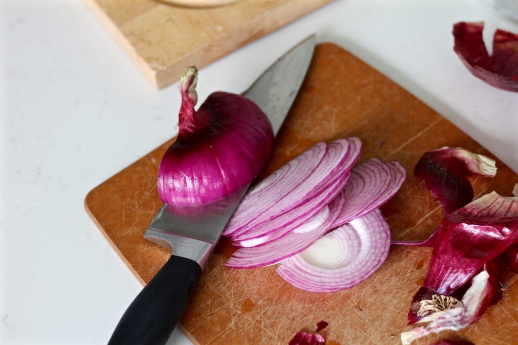 Thinly slice 1/2 a red onion.