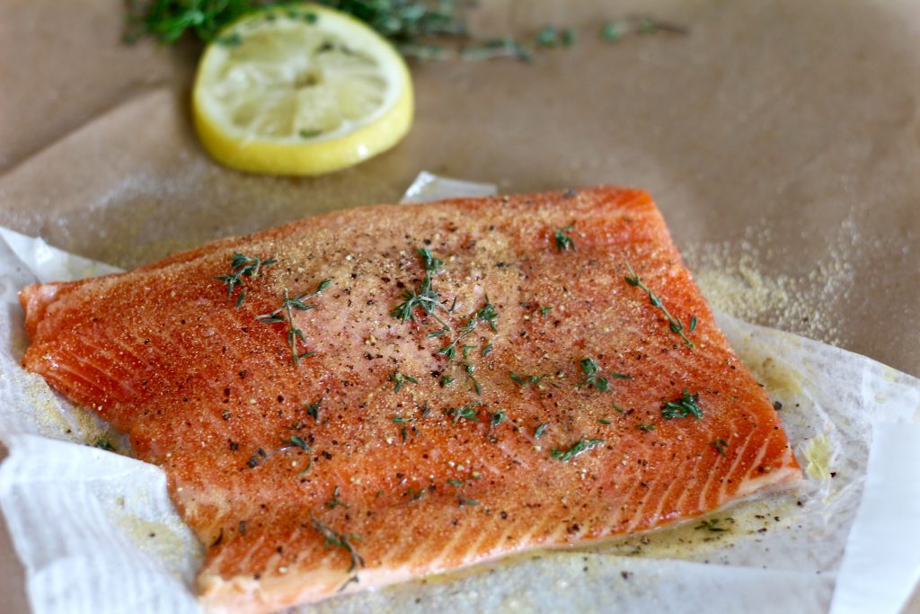 Seasoned salmon filet ready to grill.